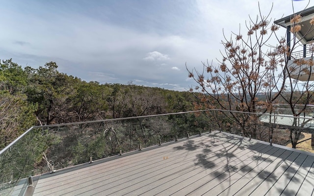 1002 Barrie Dr, Austin, TX 78734 - wooden terrace featuring a wooded view