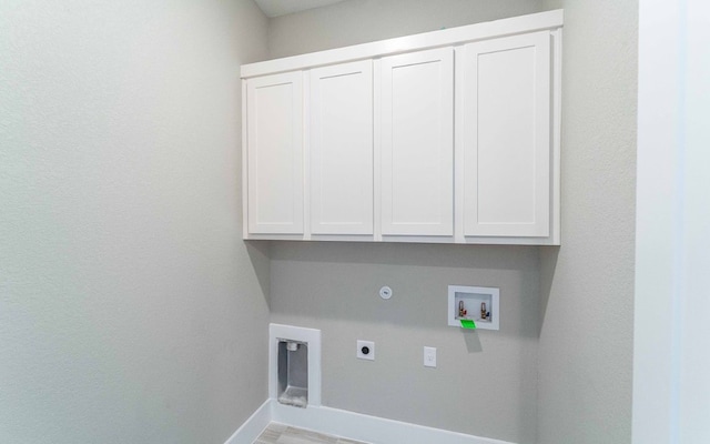 1002 Barrie Dr, Austin, TX 78734 - washroom featuring cabinet space, hookup for an electric dryer, washer hookup, and gas dryer hookup