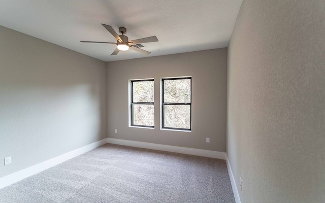 1002 Barrie Dr, Austin, TX 78734 - spare room featuring a ceiling fan and light colored carpet