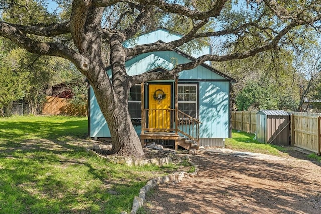 view of outbuilding featuring a yard