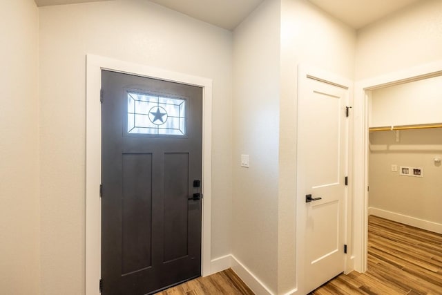 entryway featuring wood finished floors and baseboards