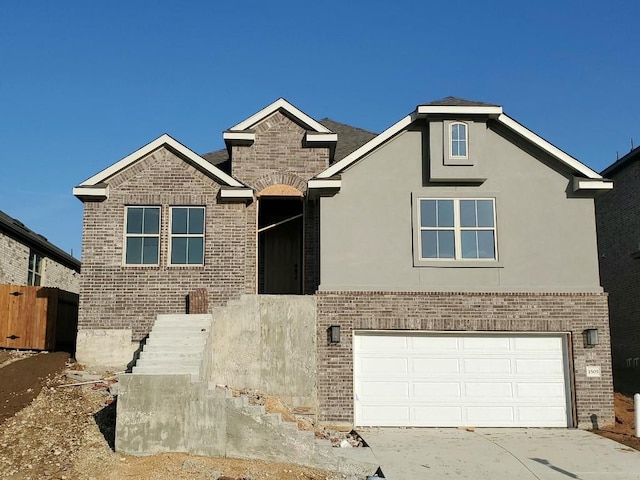 1505 Cole Estates Dr, Georgetown, TX 78628 - traditional-style home featuring brick siding, an attached garage, driveway, and stucco siding