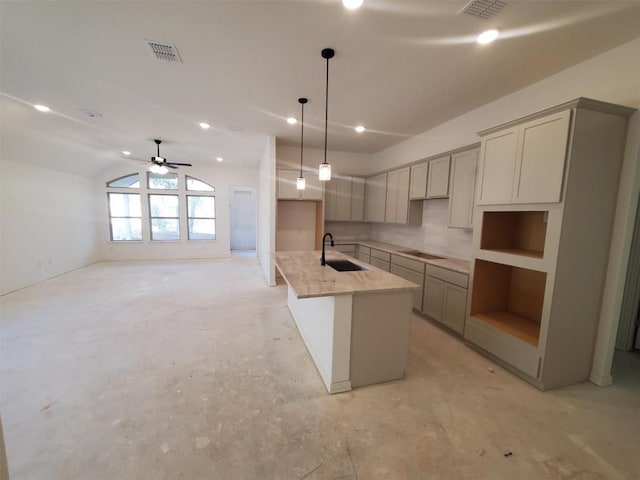 1505 Cole Estates Dr, Georgetown, TX 78628 - kitchen with a center island with sink, a ceiling fan, gray cabinetry, vaulted ceiling, and decorative light fixtures