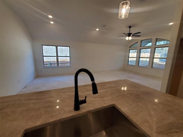 1505 Cole Estates Dr, Georgetown, TX 78628 - kitchen with lofted ceiling, carpet, open floor plan, ceiling fan, and stone countertops