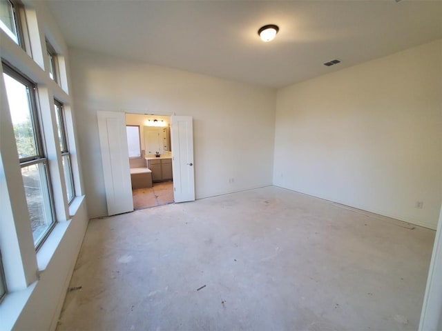 1505 Cole Estates Dr, Georgetown, TX 78628 - empty room with plenty of natural light and unfinished concrete flooring