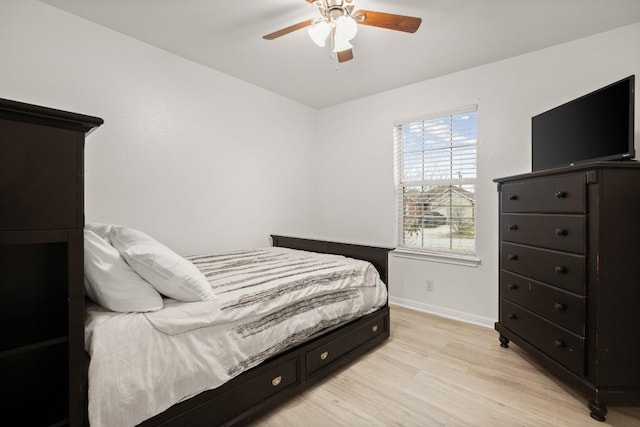 bedroom with ceiling fan and light hardwood / wood-style flooring