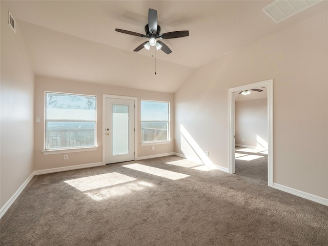 carpeted empty room with lofted ceiling and ceiling fan