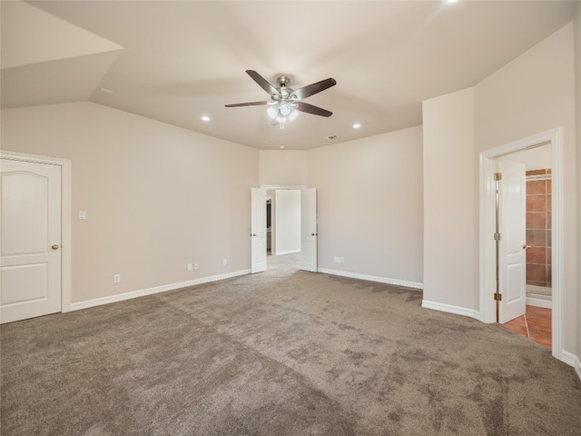 spare room with lofted ceiling, carpet flooring, and ceiling fan