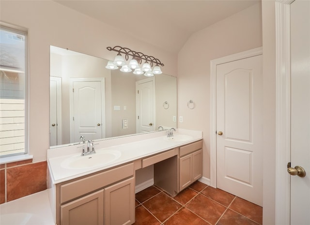 bathroom featuring lofted ceiling, tile patterned flooring, and vanity