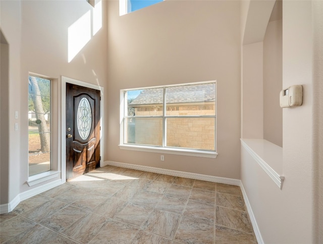 foyer with a towering ceiling