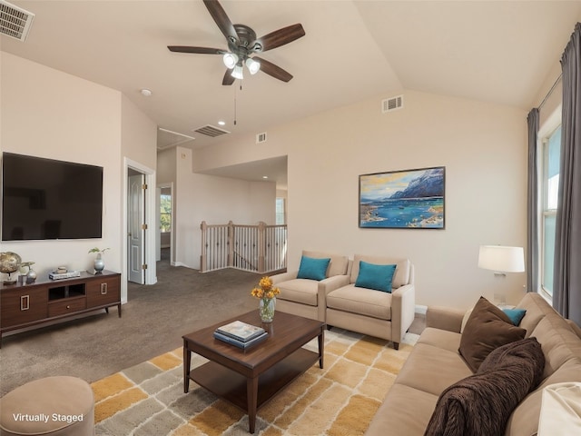 carpeted living room featuring lofted ceiling and ceiling fan