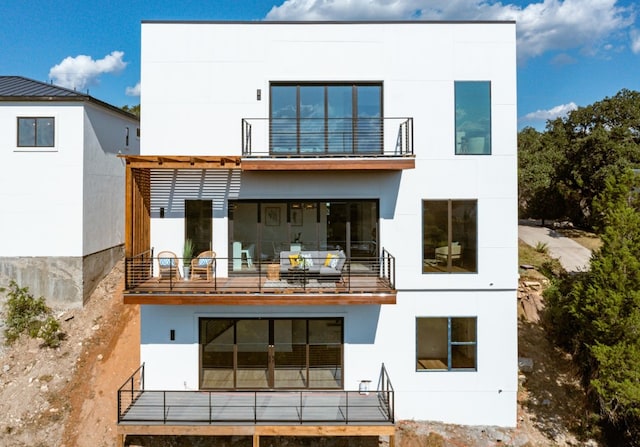 14413 Cochise Trl, Austin, TX 78734 - back of house featuring a balcony and stucco siding