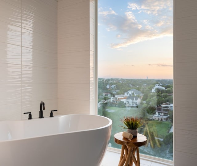 14413 Cochise Trl, Austin, TX 78734 - bathroom with a freestanding bath and tile patterned flooring