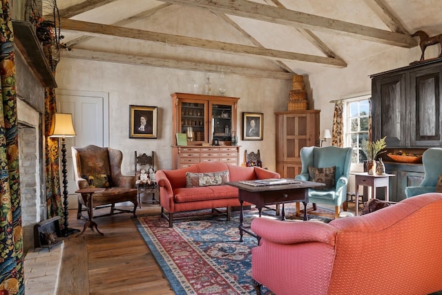 living area featuring high vaulted ceiling, wood finished floors, and beam ceiling