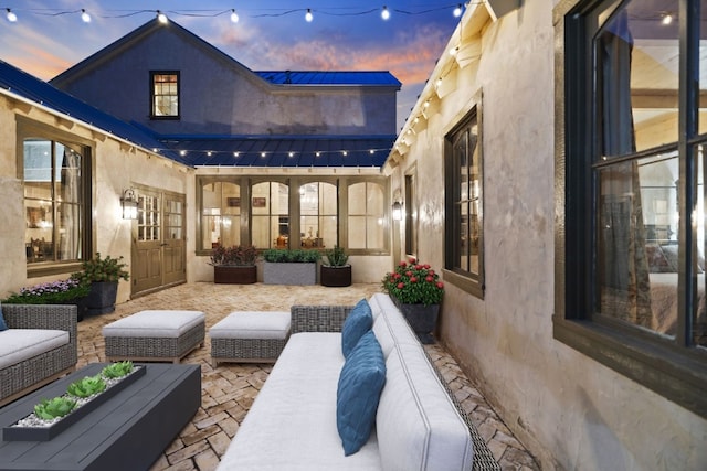 patio terrace at dusk with outdoor lounge area