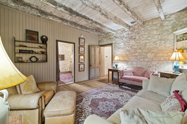 living room featuring wooden ceiling, wood finished floors, and beam ceiling