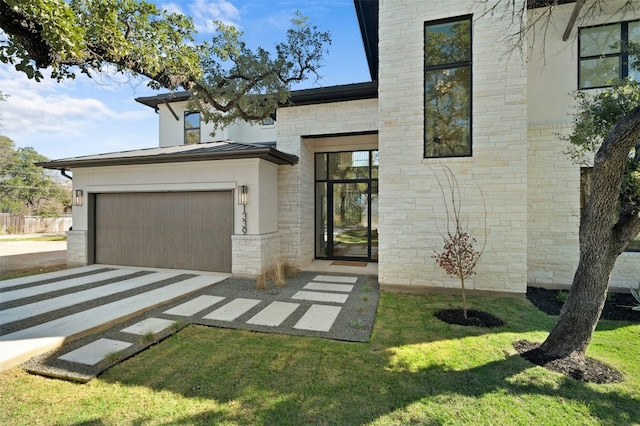 1339 Allen Rd, Austin, TX 78746 - contemporary home featuring stone siding, a standing seam roof, a front lawn, driveway, and a metal roof