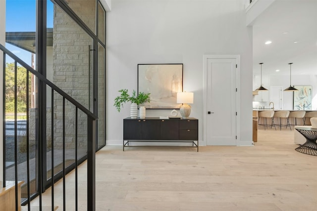 1339 Allen Rd, Austin, TX 78746 - hall with a high ceiling, light wood-style floors, recessed lighting, and stairway