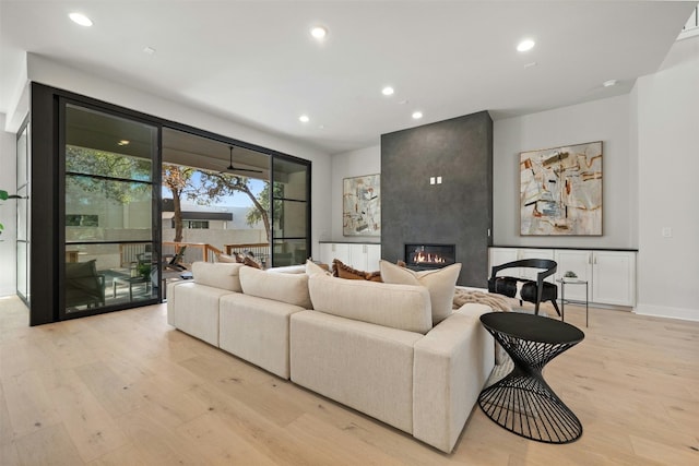 1339 Allen Rd, Austin, TX 78746 - living area featuring light wood-type flooring, a large fireplace, and recessed lighting