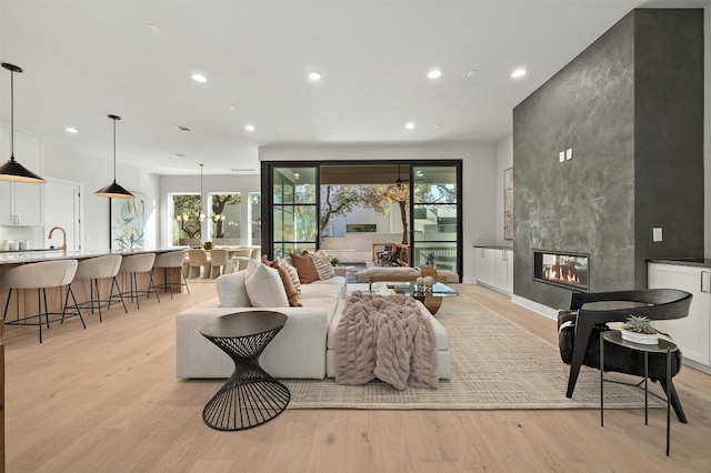 1339 Allen Rd, Austin, TX 78746 - living area featuring recessed lighting, light wood-style flooring, and a fireplace