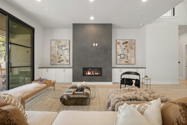1339 Allen Rd, Austin, TX 78746 - living room featuring recessed lighting, light wood-style floors, plenty of natural light, and a fireplace