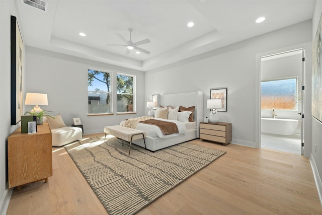 1339 Allen Rd, Austin, TX 78746 - bedroom featuring light wood finished floors, recessed lighting, a tray ceiling, and ceiling fan