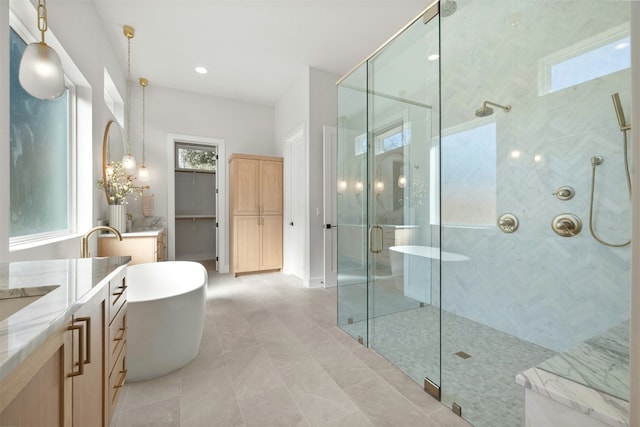 1339 Allen Rd, Austin, TX 78746 - bathroom featuring a stall shower, a soaking tub, vanity, and tile patterned floors