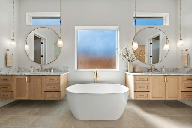1339 Allen Rd, Austin, TX 78746 - bathroom with two vanities and a freestanding bath