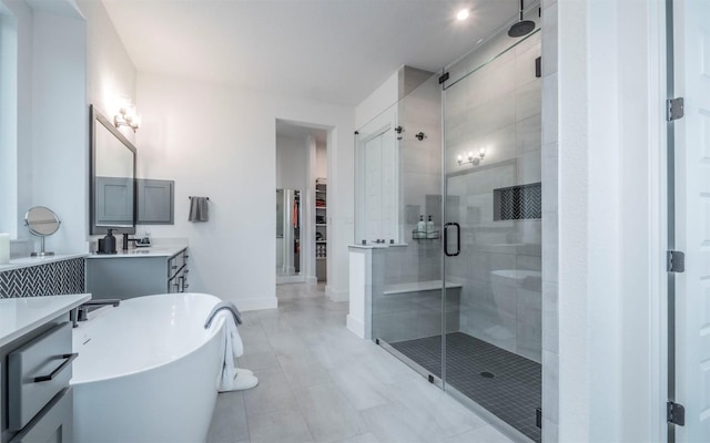 5408 Destination Way, Jonestown, TX 78645 - full bath with a stall shower, vanity, a freestanding bath, and a spacious closet