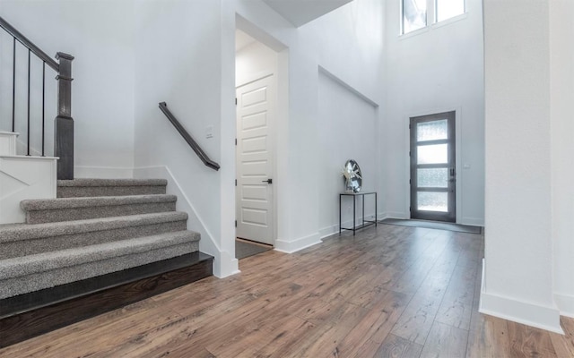 5408 Destination Way, Jonestown, TX 78645 - entrance foyer with stairs, wood-type flooring, and a towering ceiling