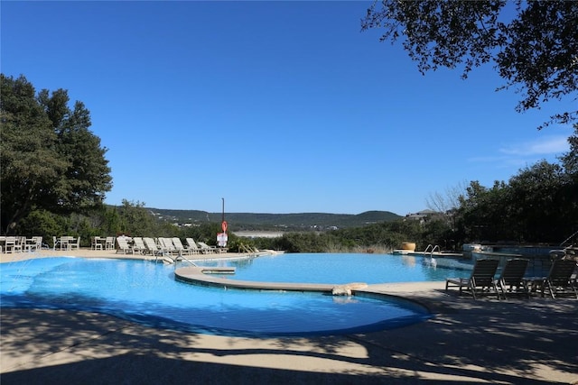 5408 Destination Way, Jonestown, TX 78645 - community pool featuring a patio area and a mountain view