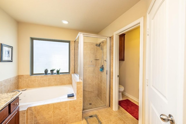 full bath with tile patterned floors, toilet, a stall shower, vanity, and a bath