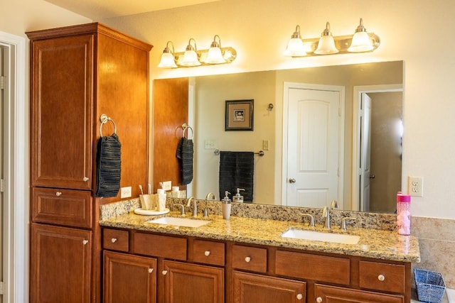 bathroom featuring double vanity and a sink