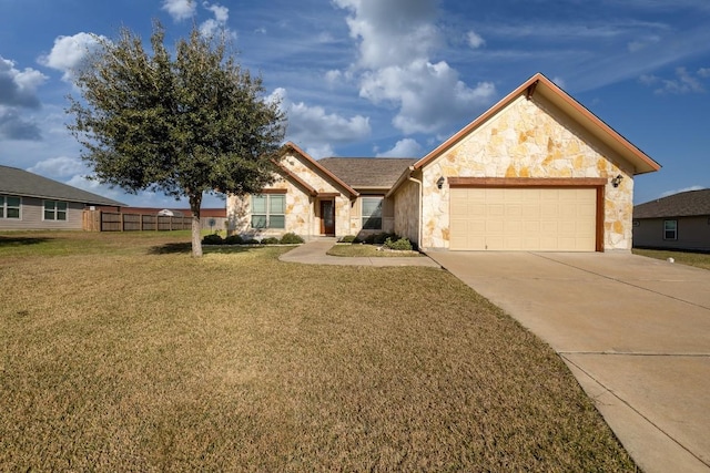 view of front of home with an attached garage, fence, stone siding, driveway, and a front yard