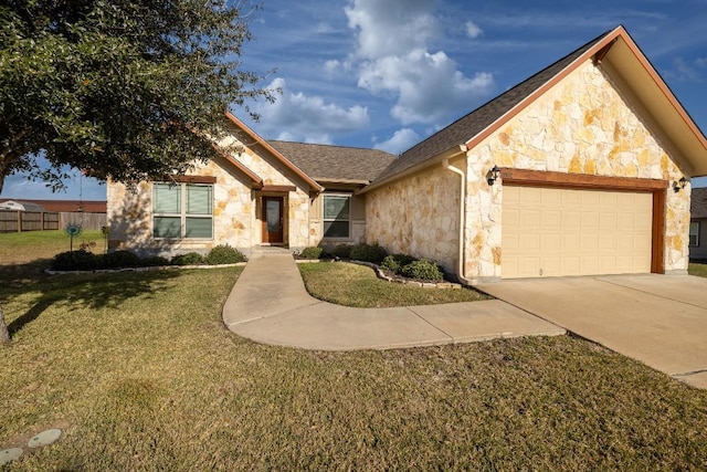 ranch-style home with an attached garage, stone siding, fence, and a front yard