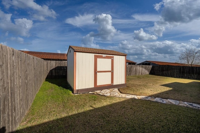 view of shed featuring a fenced backyard