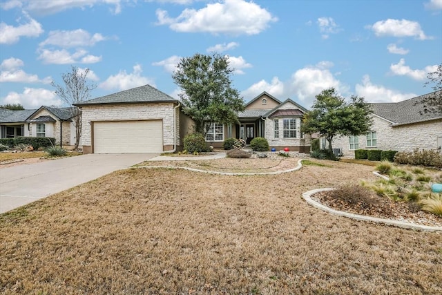 view of front of house with a front yard and a garage