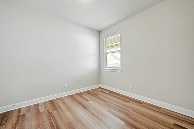 spare room featuring light hardwood / wood-style flooring