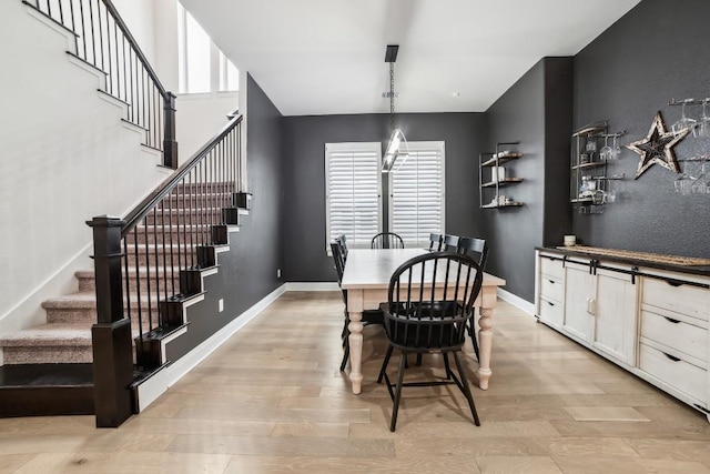 dining space featuring light hardwood / wood-style flooring