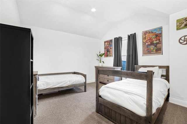 carpeted bedroom featuring lofted ceiling