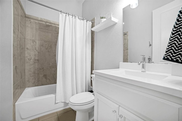 full bathroom with tile patterned floors, shower / bath combo with shower curtain, vanity, and toilet