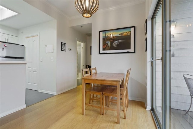 6000 Shepherd Mountain Cv Unit 1818, Austin, TX 78730 - dining space with light wood-style floors, baseboards, crown molding, and a chandelier