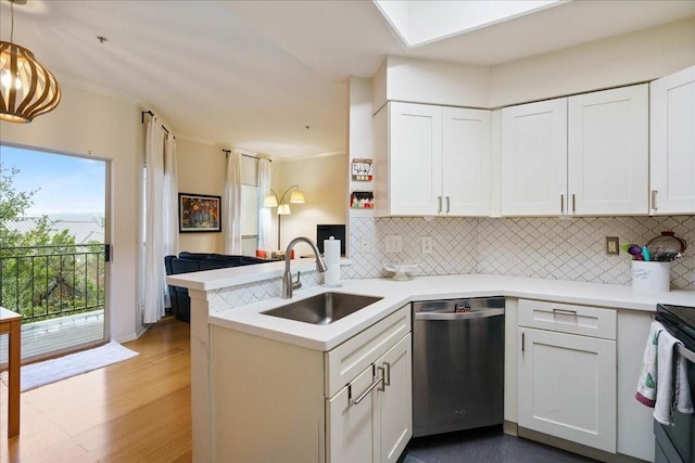 6000 Shepherd Mountain Cv Unit 1818, Austin, TX 78730 - kitchen with dishwasher, a sink, a peninsula, and backsplash