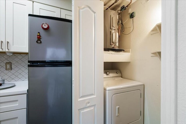 6000 Shepherd Mountain Cv Unit 1818, Austin, TX 78730 - laundry room with washer / clothes dryer and water heater