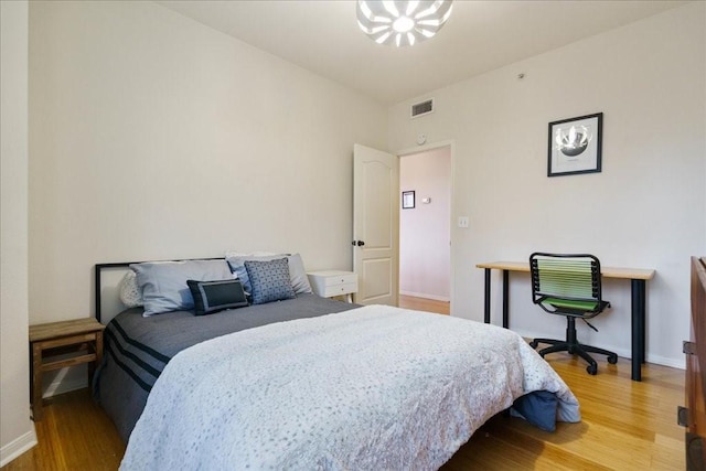 6000 Shepherd Mountain Cv Unit 1818, Austin, TX 78730 - bedroom featuring light wood-style flooring and baseboards