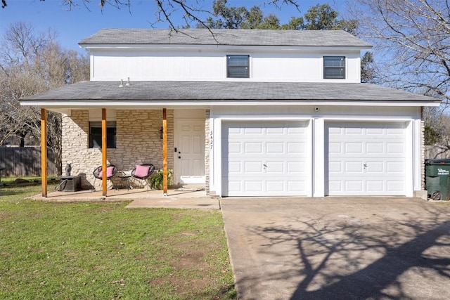 view of front of property with a garage, covered porch, and a front yard