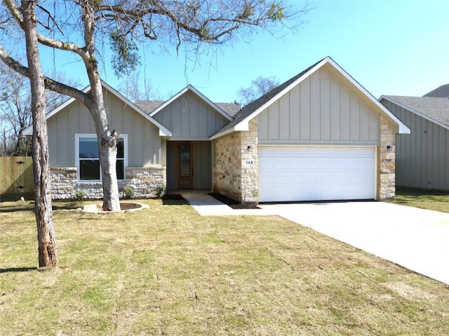 view of front of house with a garage and a front yard