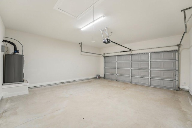 garage featuring water heater and a garage door opener