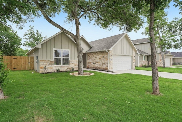 view of front of home featuring driveway, stone siding, board and batten siding, an attached garage, and fence