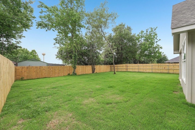 view of yard featuring a fenced backyard